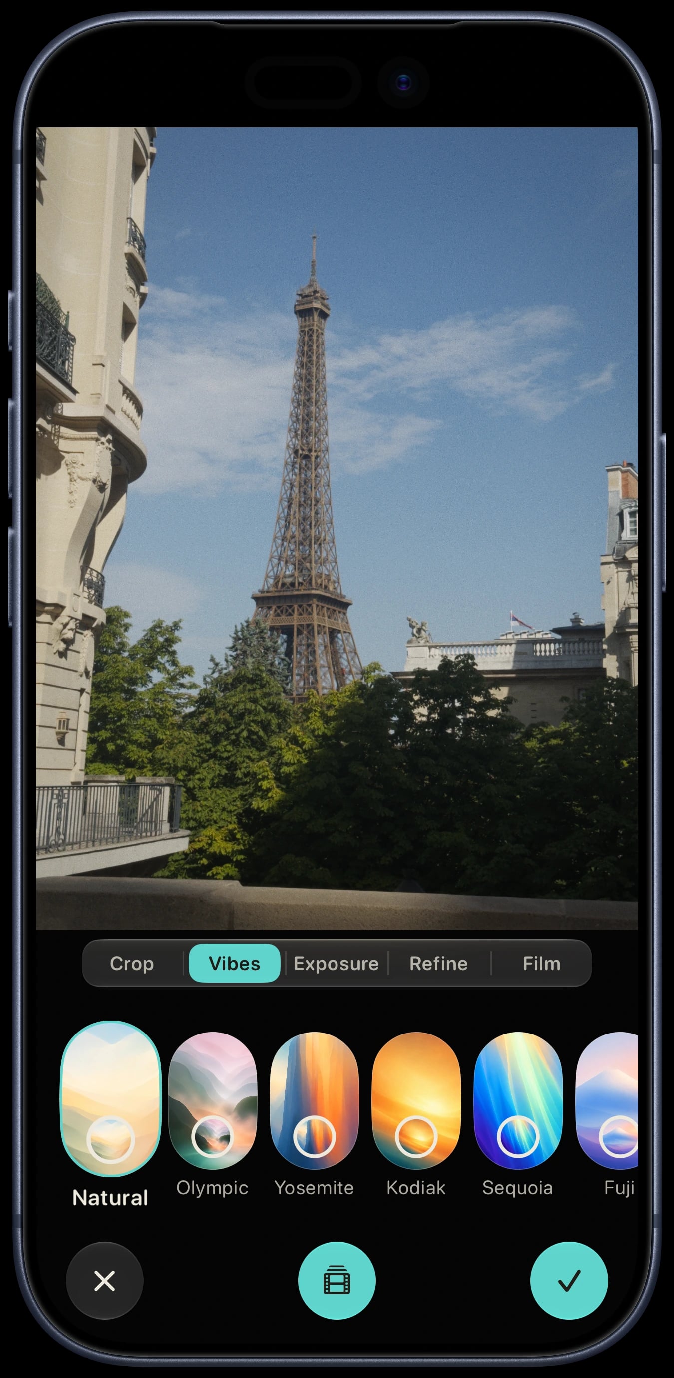 Sundae Lab on a deep blue iPhone 17 Pro, showing the Vibes editor for an Eiffel Tower RAW photo.