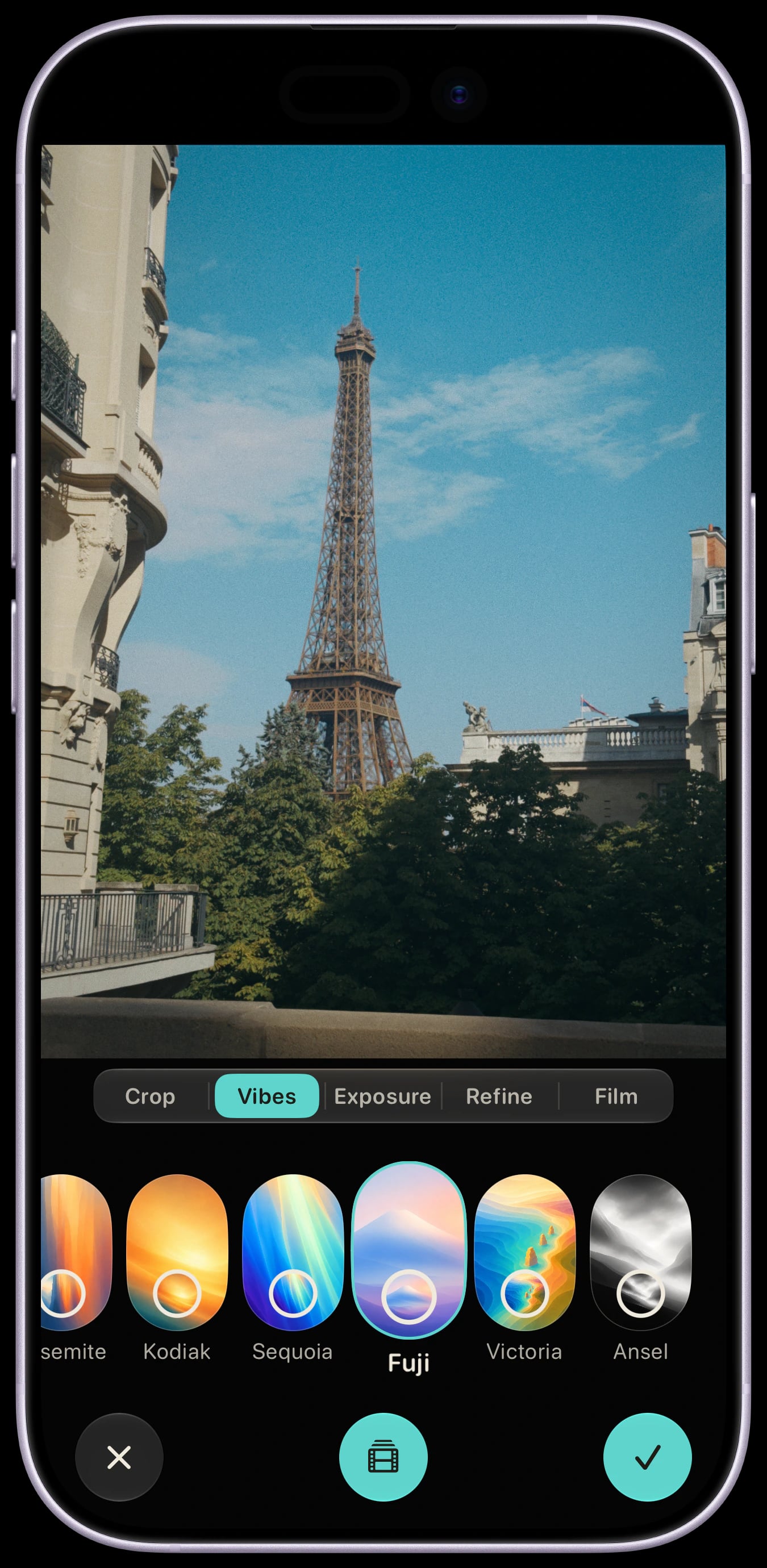 Sundae Gallery Editor on a Lavender iPhone 17, editing an Eiffel Tower photograph with the Vibes panel open and Fuji selected and applied to the preview.