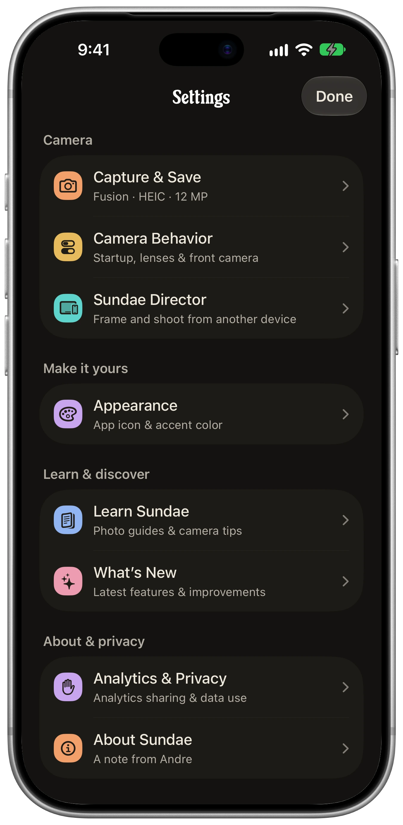 Sundae Settings on a silver iPhone 18 Pro, showing Camera, Appearance, Learn & discover, and About & privacy.