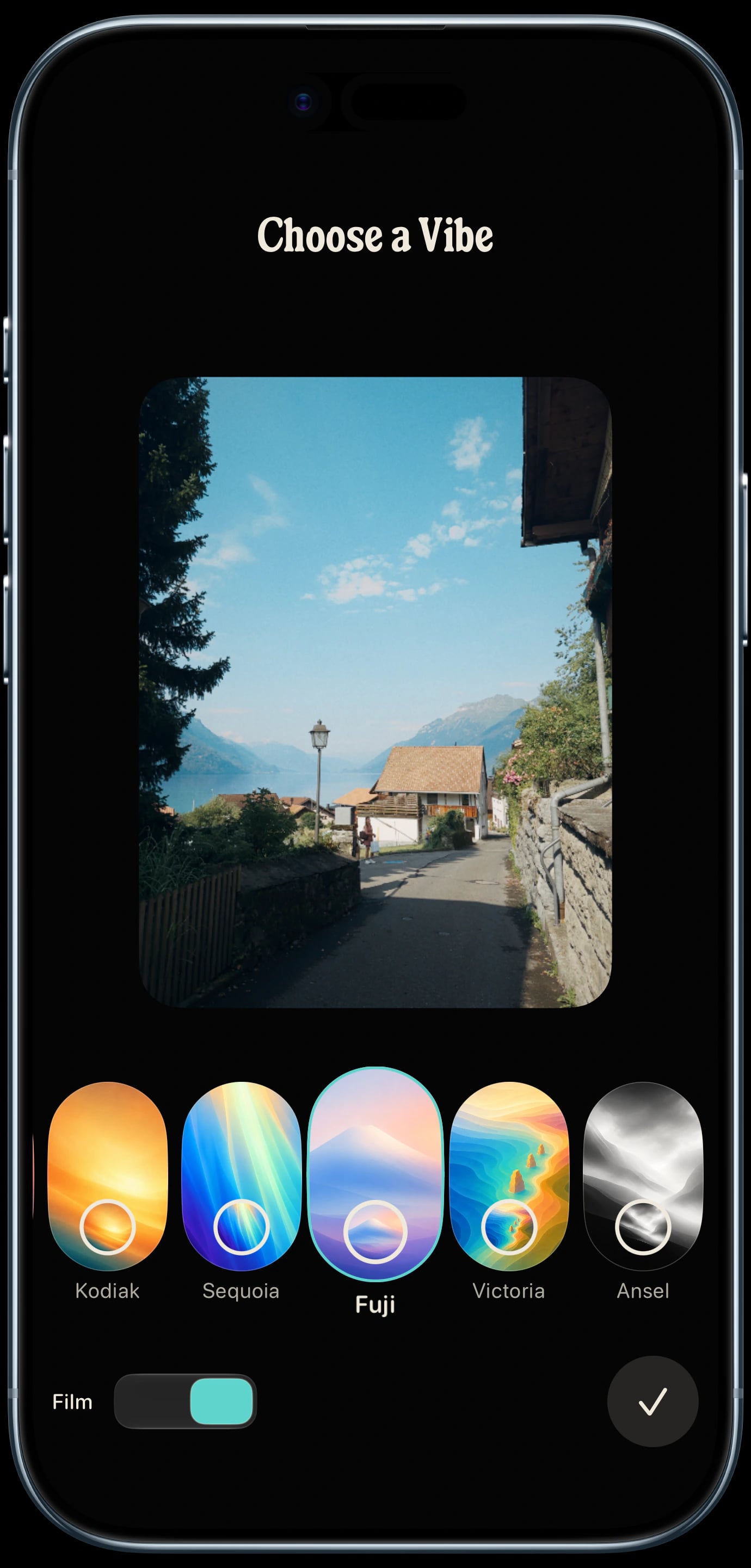 Sundae Vibe picker on a sky blue iPhone Air, previewing a Swiss lakeside village with Fuji selected and Kodiak, Sequoia, Victoria, and Ansel visible.